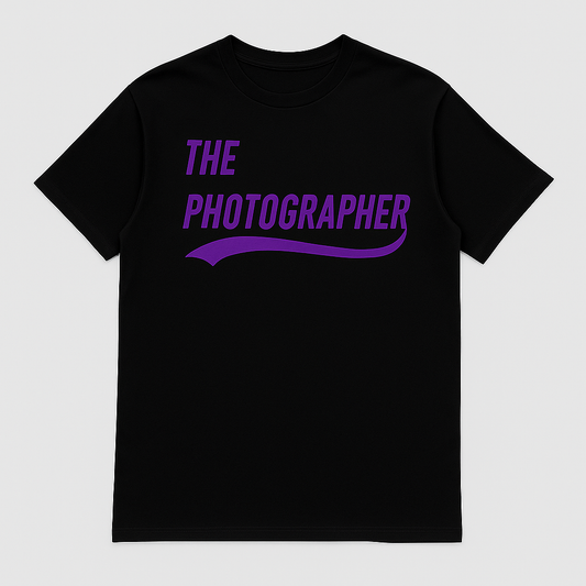Black t-shirt with 'The Photographer' text in purple on a light gray background